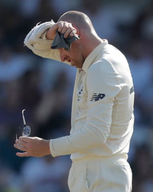 Jack Leach wipes his brow and cleans his spectacles.