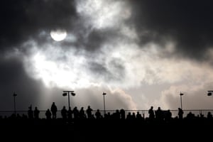 Spectators at the top of the party stand as storm clouds roll in during day two.
