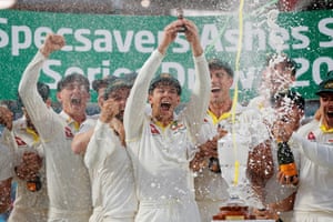Australia lift the urn after retaining the Ashes.